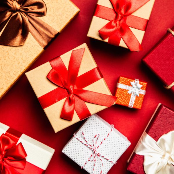 Assorted Gift Boxes on Red Surface