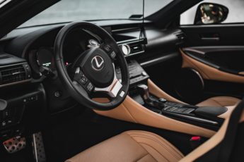 A photo of Lexus car with black and brown interior focusing on front seat view