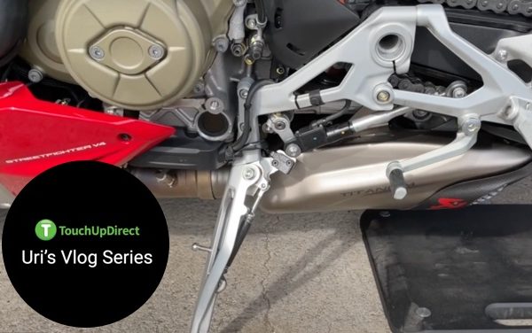 A snippet of a motorcycle focusing on the lower part for TouchUpDirect Uri's Vlog Series