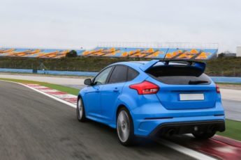 A blue ford focus RS drove in the racing track