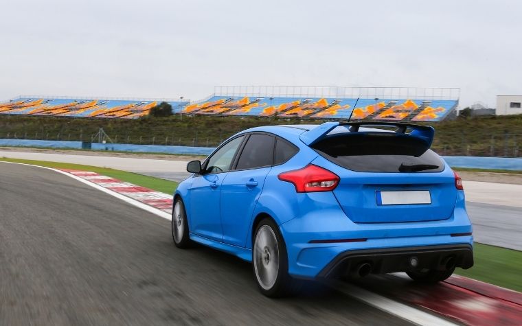 A blue ford focus RS drove in the racing track