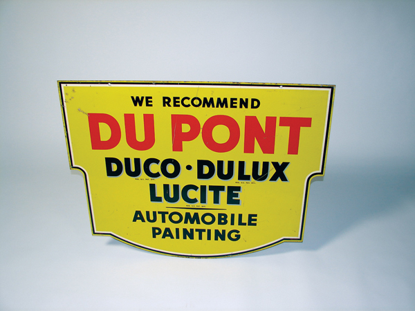A sign advertising Du Ponts Duco Automobile paints.