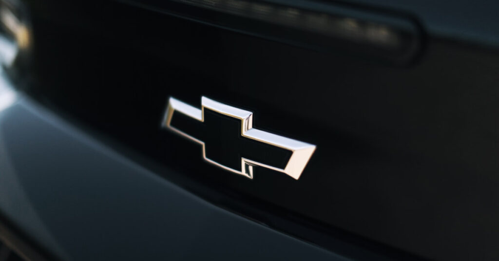 The Chevrolet bowtie emblem on the front of one of their vehicles.