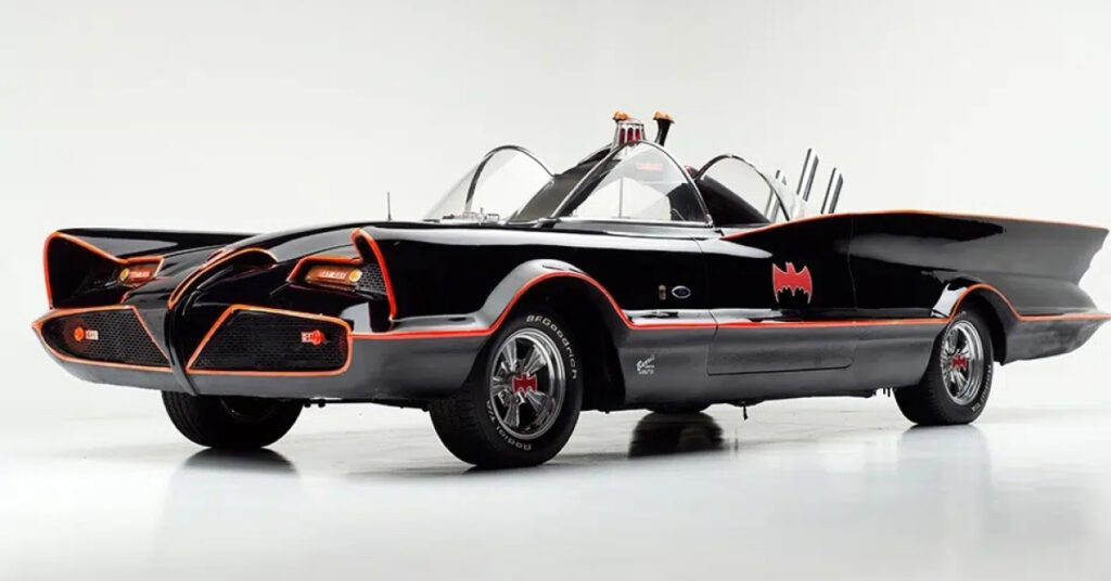 The Ford Futura Batmobile is black with red piping. It has a futuristic design with bubble windows and sculpted tailfins.